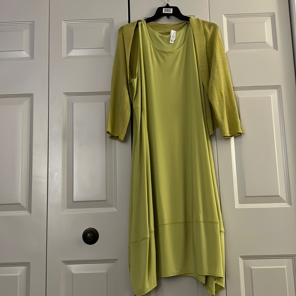 Lime green plus size sleeveless dress with matching shrug that has pockets